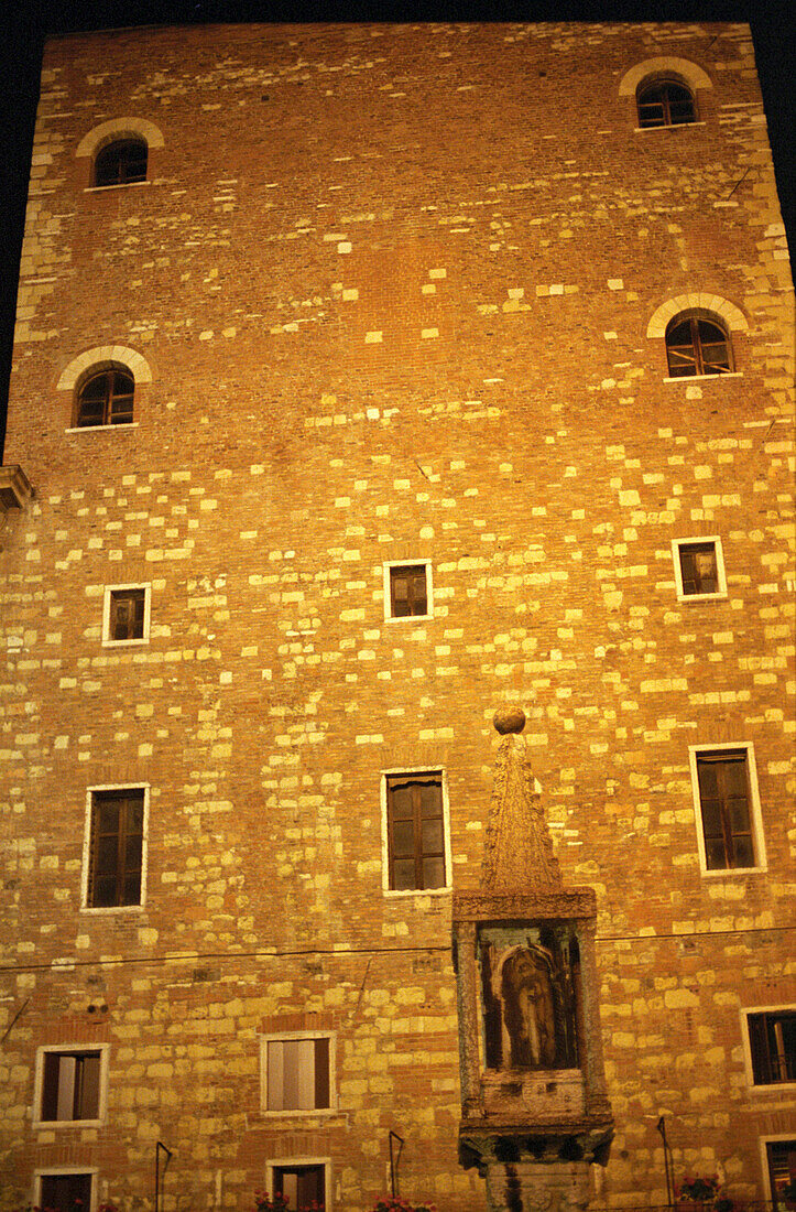 Historical facede, side building of Torre Lamberti, Verona, Italy