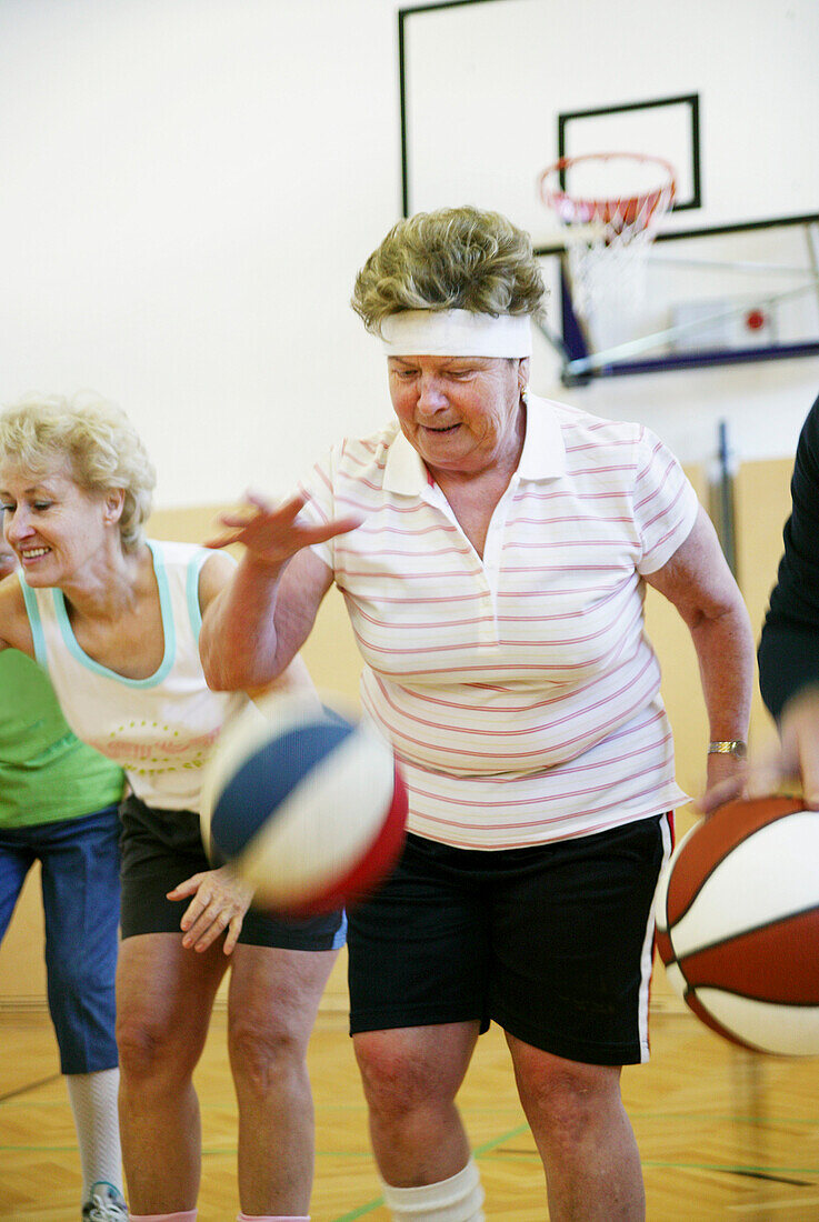 Mature People playing basketball