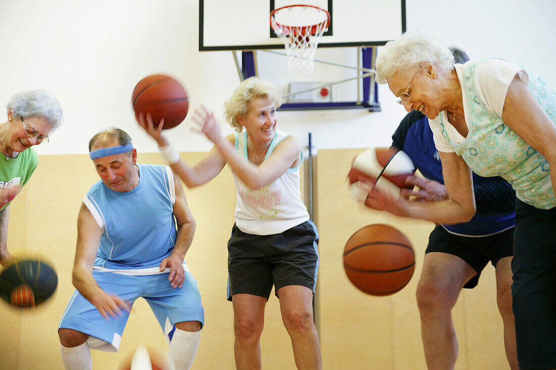 Mature People playing basketball