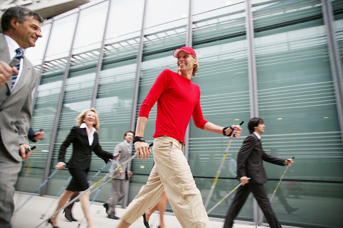 Businesspeople doing Nordic Walking