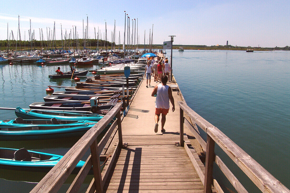 People on a jetty at lake Cospuden, Leipzig, Saxony, Germany, Europe