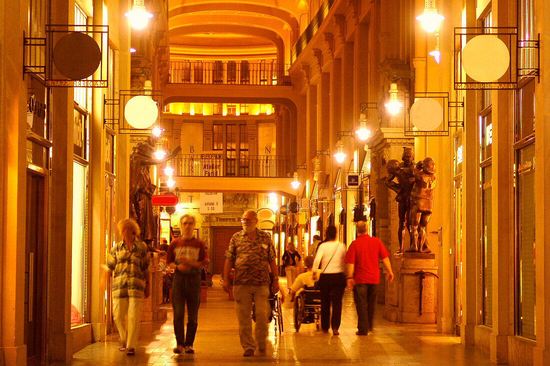 People in the Maedler Passage arcades in the evening, Leipzig, Saxony, Germany