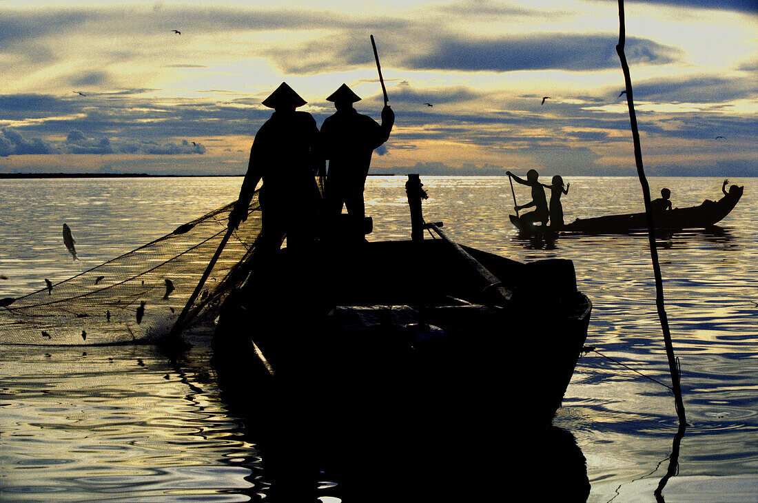 Fisherman with net, Tonle Sap Lake, Siem Reap Province, Cambodia, Indochina