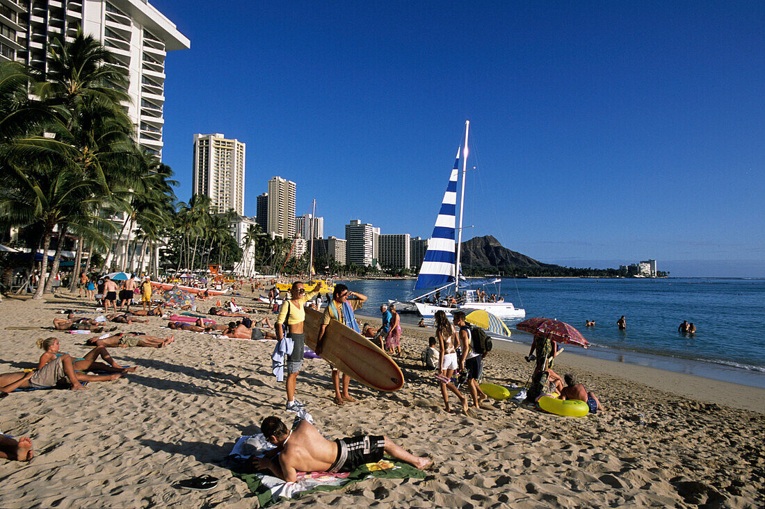 Surfer on Waikiki Beach, Honolulu, Oahu, Hawaii, USA