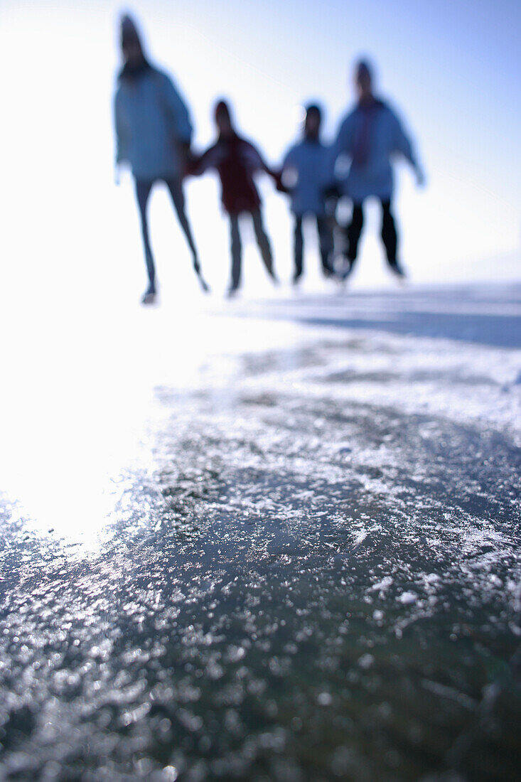 Family ice skating, Ambach, Lake Starnberg, Bavaria, Germany