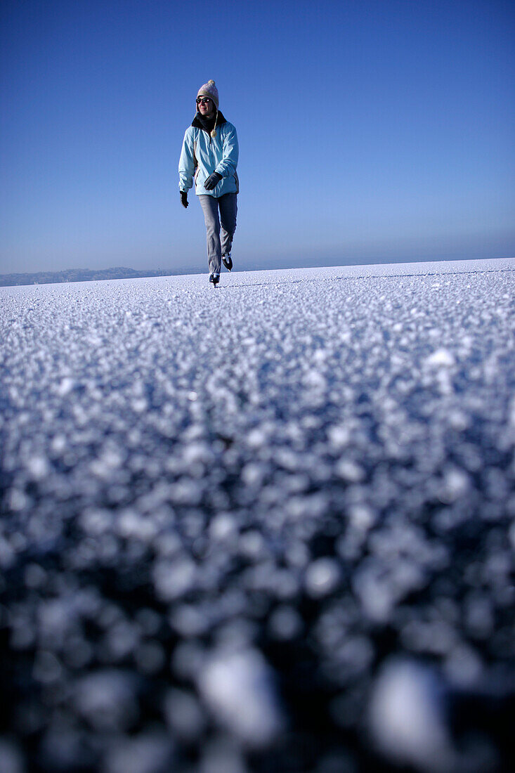 Young woman ice skating