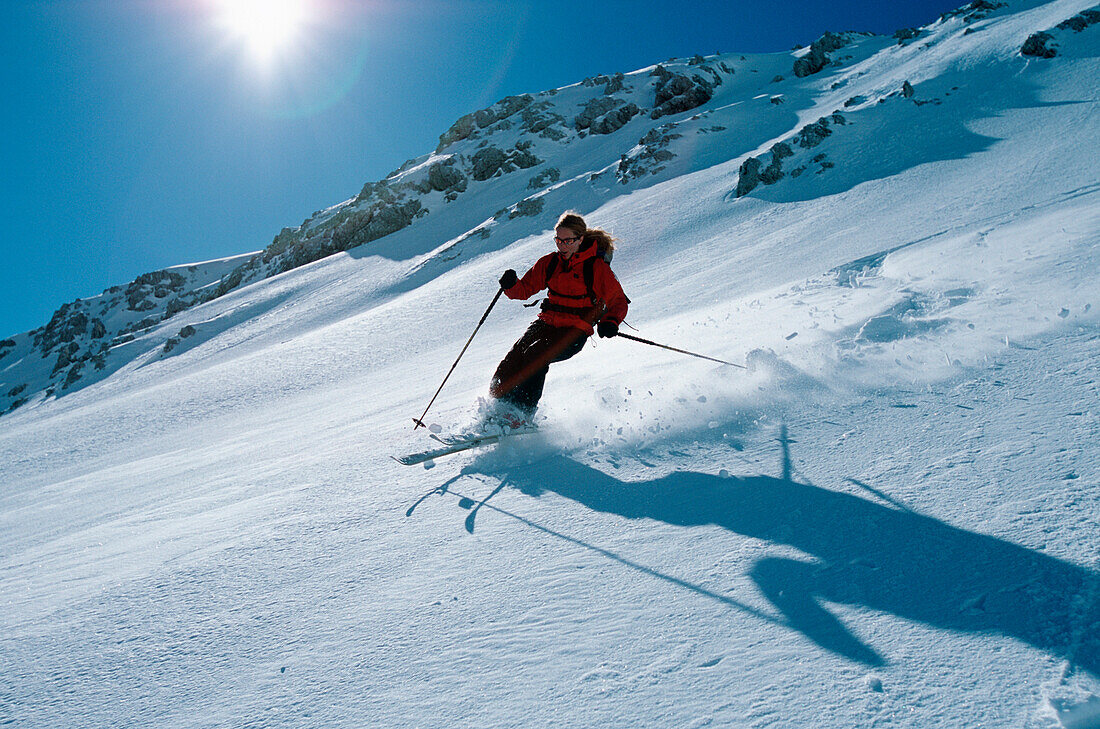 Female skier on Griesskar, Alpspitze, Garmisch Partenkirchen, Germany