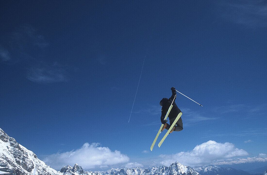 Male skier in air, side view, Zugspitze, Garmisch-Partenkirchen, Germany