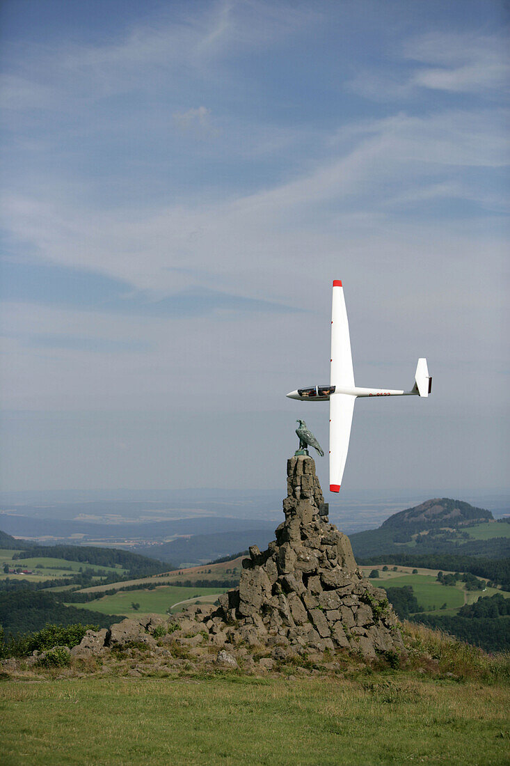 Glider Airplane behind Aviator Monument, Wasserkuppe Mountain, Rhoen, Hesse, Germany