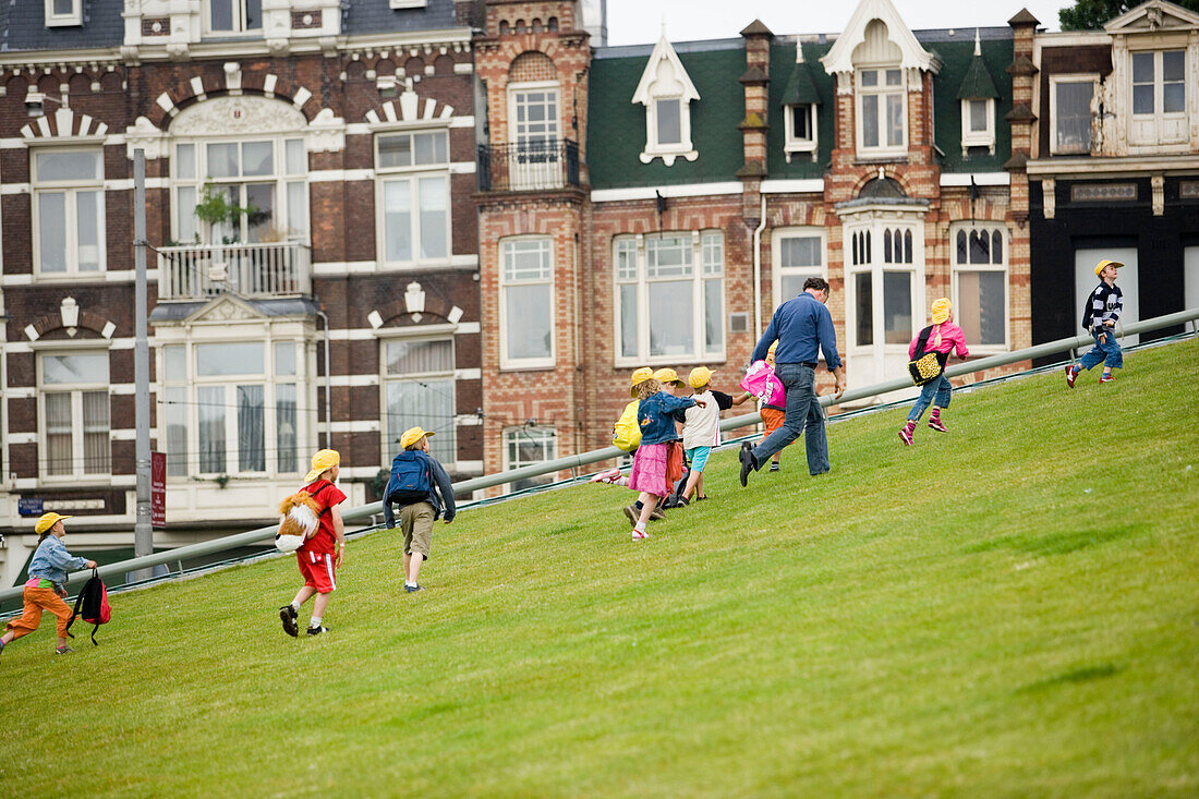 Pupils, Museumsplein, Meadow, Pupils playing on meadow, houses in background, Museumsplein, Amsterdam, Holland, Netherlands