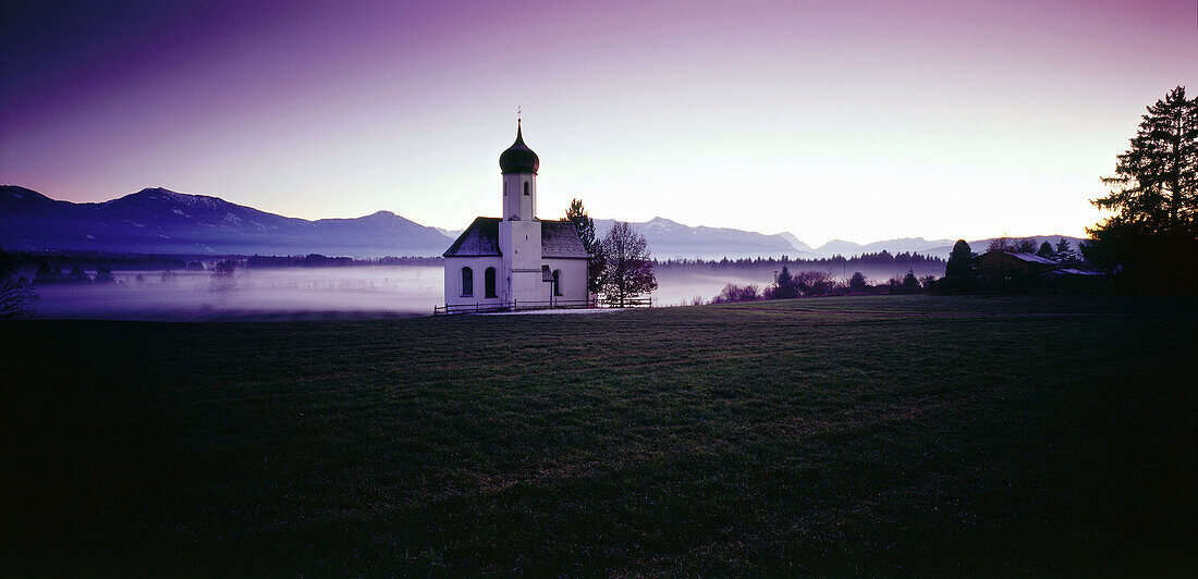 Chapel in misty landscape, Upper Bavaria, Germany