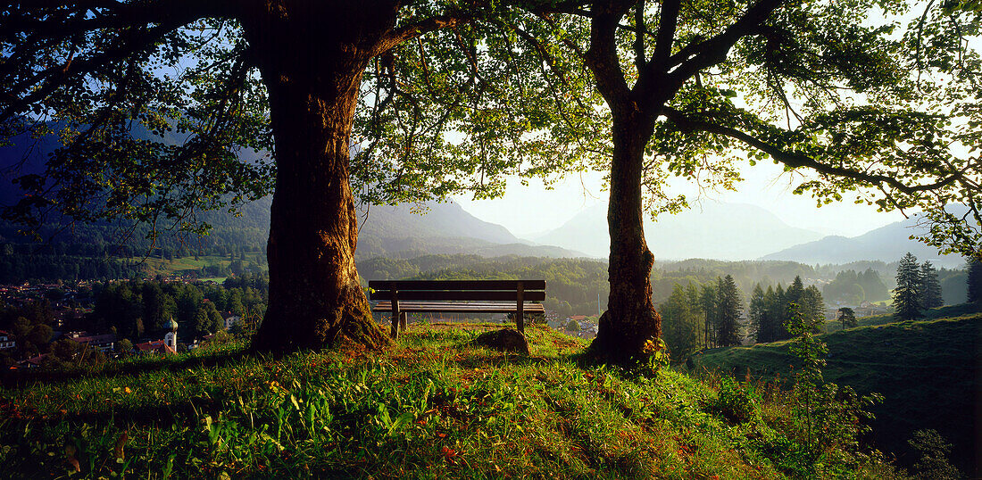 Bench and scenic mountain vista, Grainau, Upper Bavaria, Germany, rear view