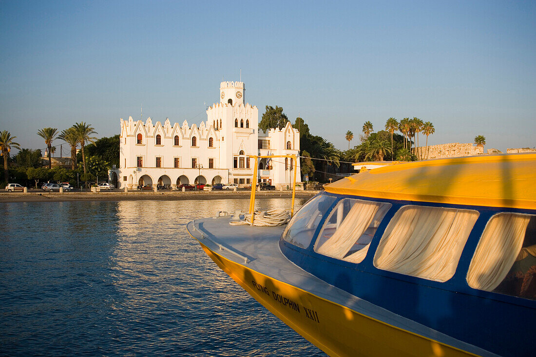 View over a boat to the Palazzo di Giustizia, built 1928 during the italian occupying time, Kos-Town, Kos, Greece