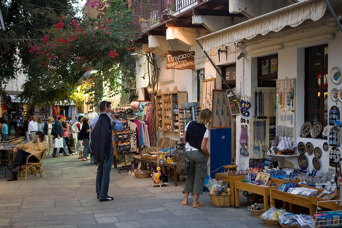 People strolling over shopping street Odos Ifestou with souvenir shops in the evening, old town, Kos-Town, Kos, Greece