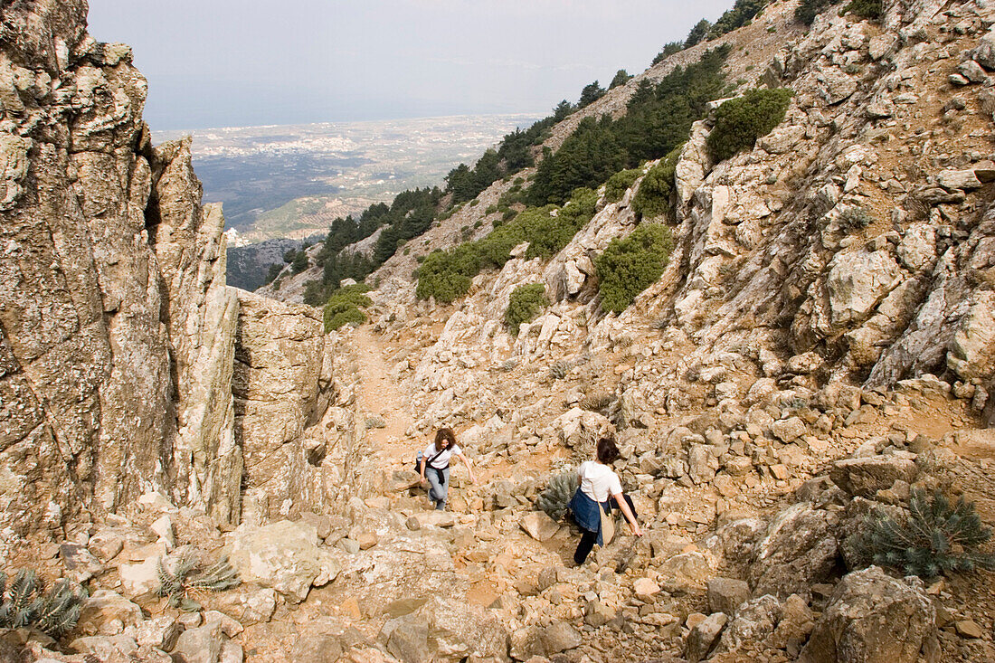 Women hiking to summit of Dikeos mountain, Zia, Kos, Greece