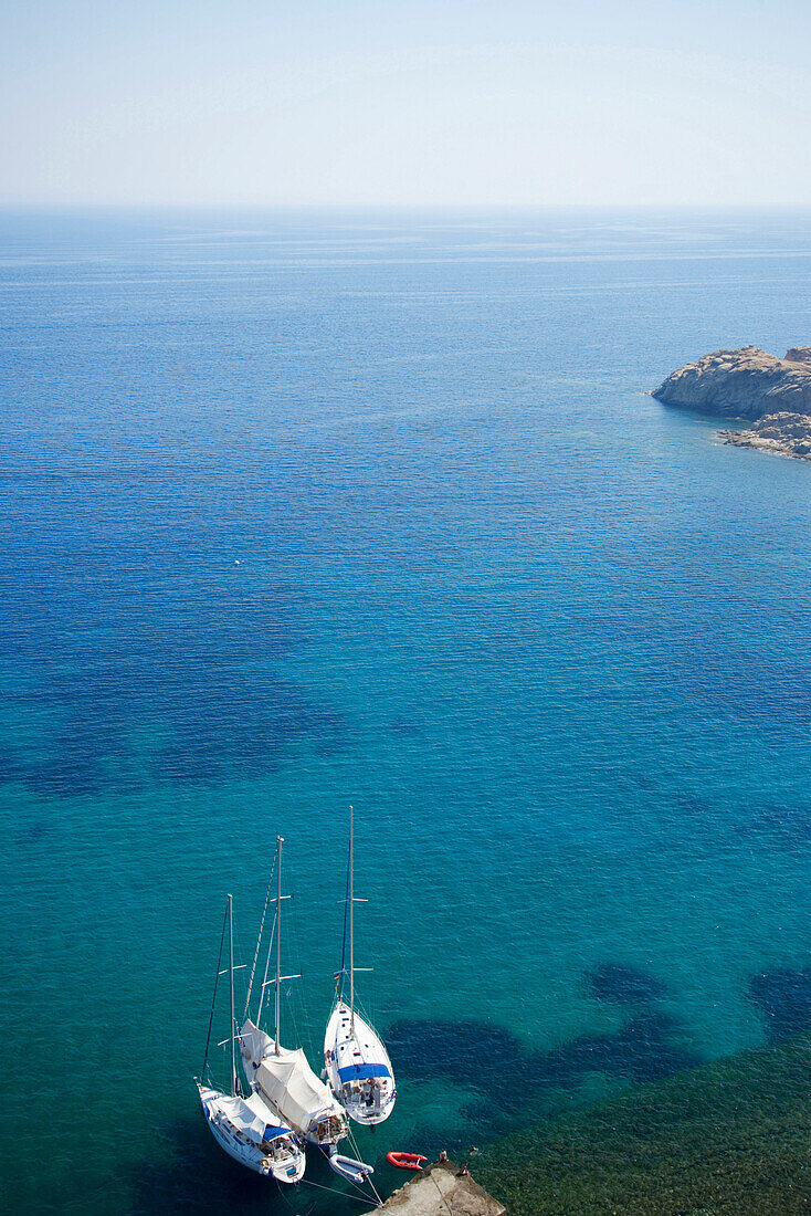 Aerial shot of three sailingboats anchoring at Paradise Beach, Mykonos, Greece