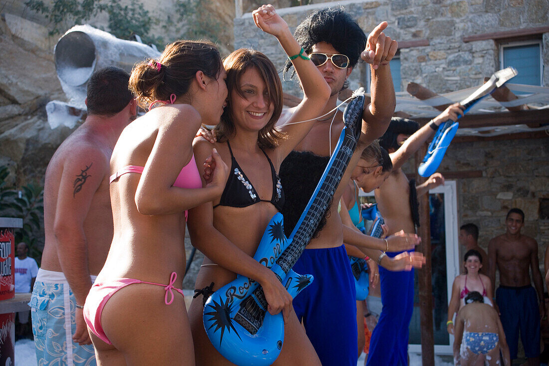 Young people amusing during a beach party of the Paradise Club, Paradise Beach, Mykonos, Greece