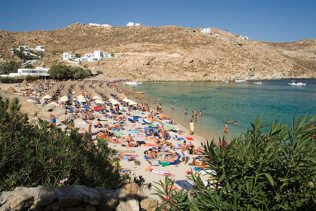 People bathing at Super Paradise Beach, knowing as a centrum of gays and nudism, Psarou, Mykonos, Greece