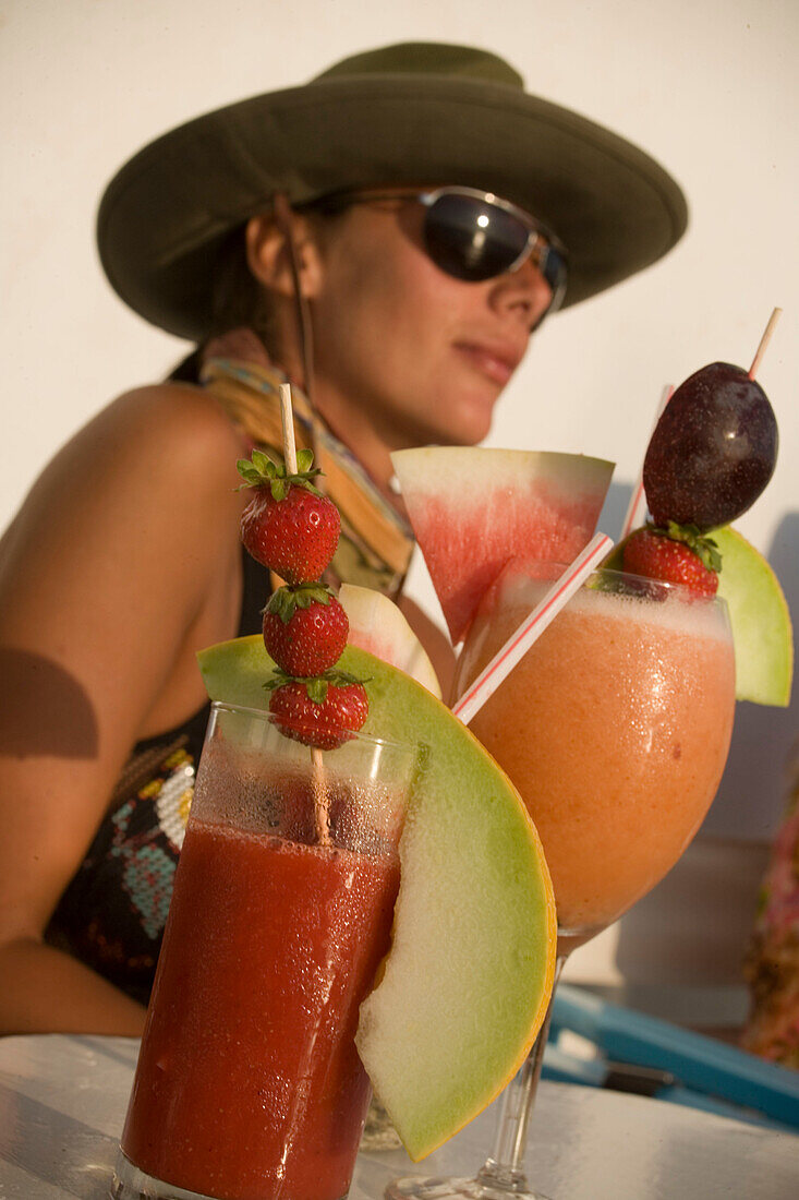 Different cocktails, for example Sundowner of the Caprice Bar, woman sitting in background, Little Venice, Mykonos-Town, Mykonos, Greece