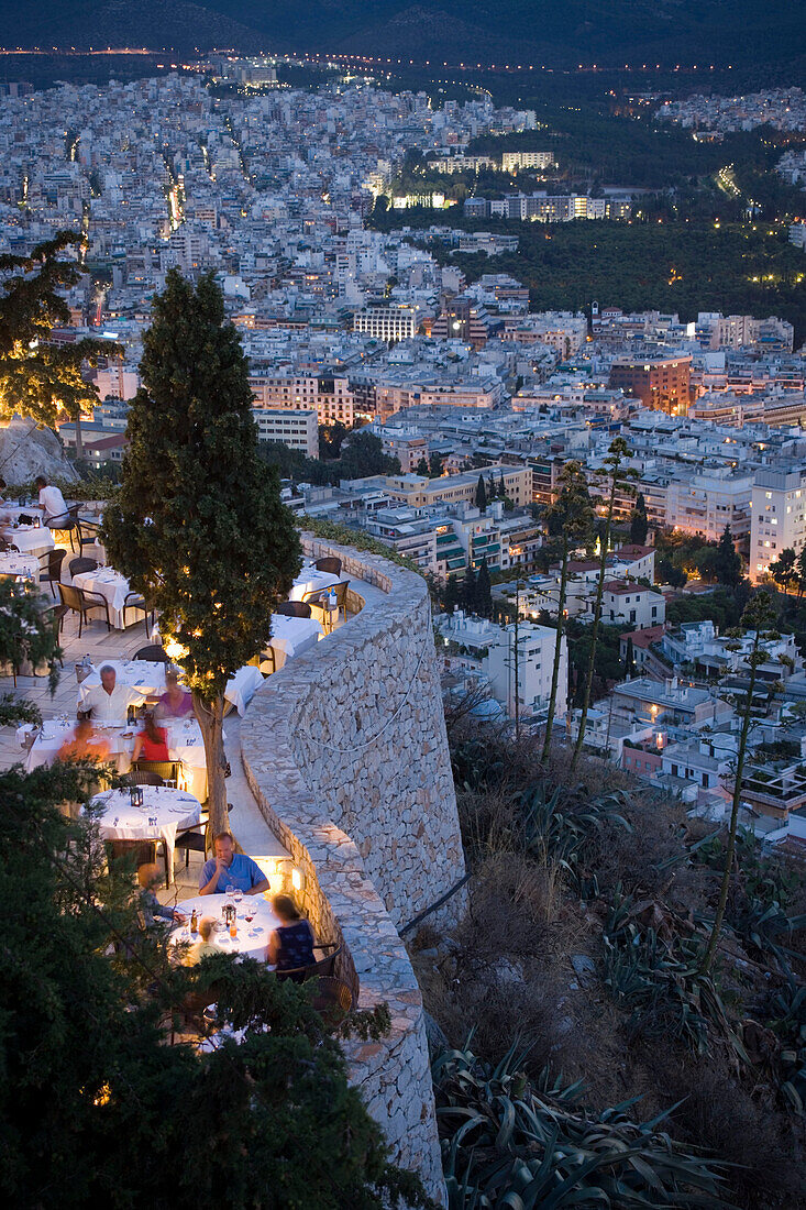 View from the Lykavittos Hill over the restaurant Orizontes to the ocean of houses of the town at night, Athens, Athens-Piraeus, Greece