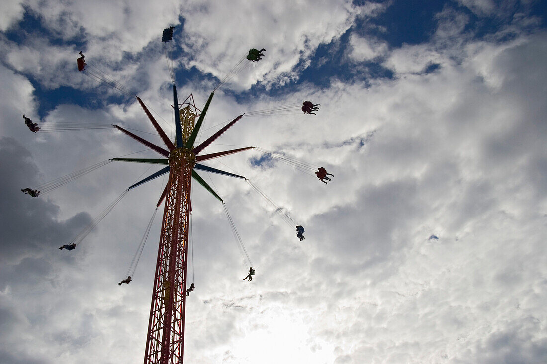 Fairground swing chair ride, low angle view, Oktoberfest, Munich Bavaria, Germany