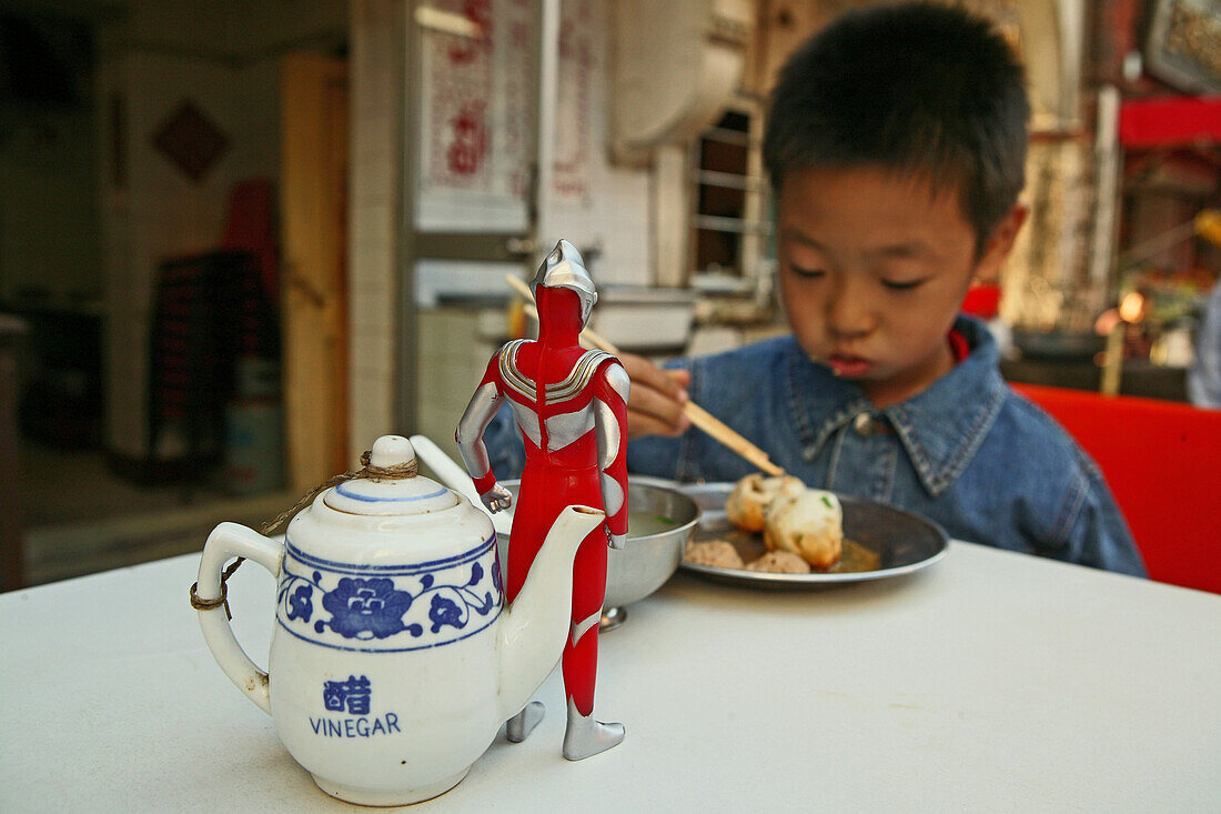 kid, child,young boy Superman toy eating dumpling, biaozi, Little Emperor