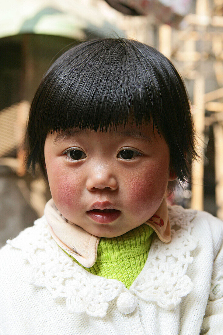 young chinese girl in back lane, old town