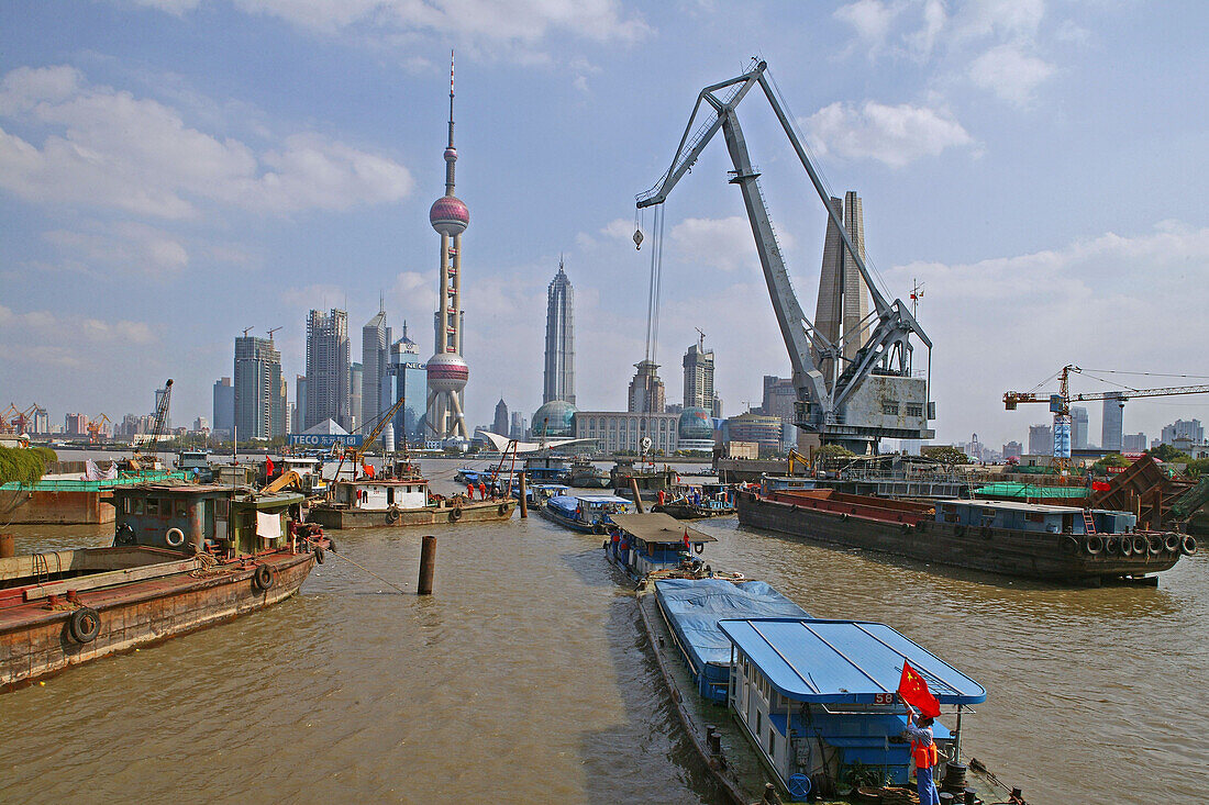Harbour,View from Waibaidu Bridge, Huangpu-River, Pudong, line of freight barges, chinese flag