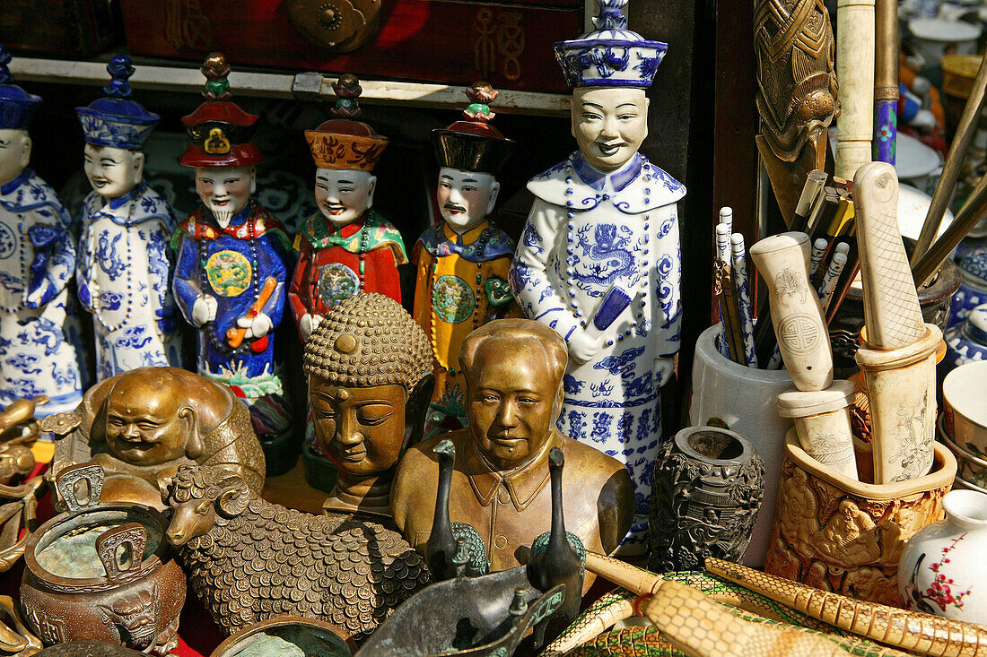 Mao and Buddha miniatures, souvenir stall, China