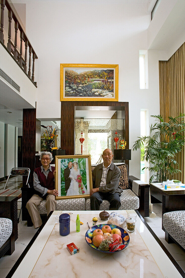 old couple in modern villa,old couple with wedding picture, living room, luxury apartment, western Shanghai, interieur, private house, interior, new suburb