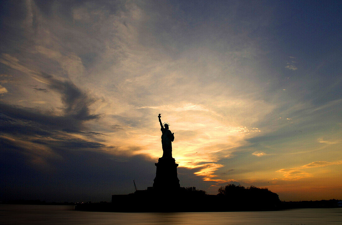 Sunset over the Statue of Liberty, New York, USA