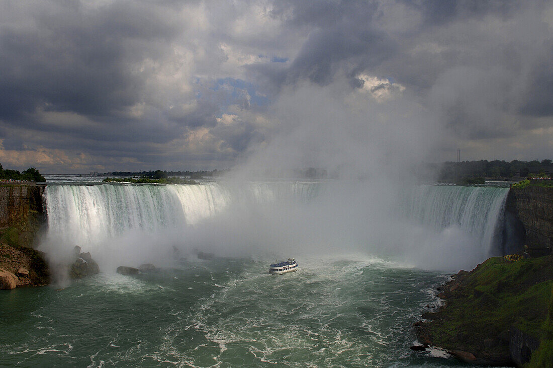 The Maid of the Mist infront of the Niagara Falls, Ontario, Canada