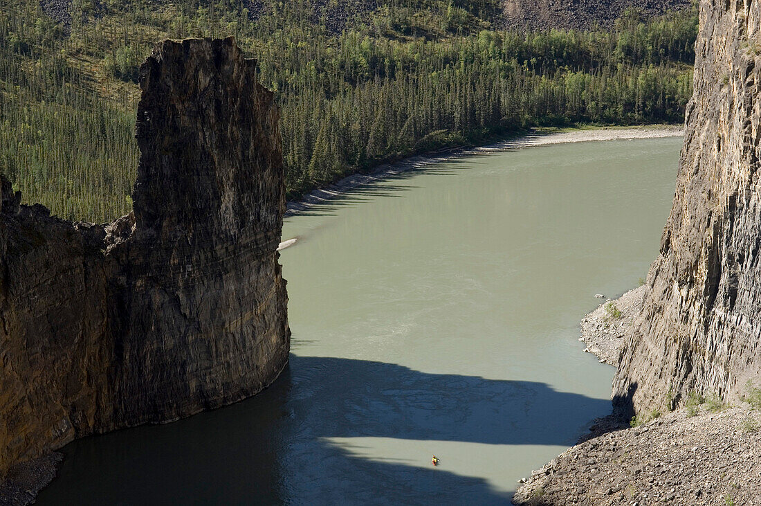 View on Nahanni River and canoo in the distance, Northwest Territories, Canada