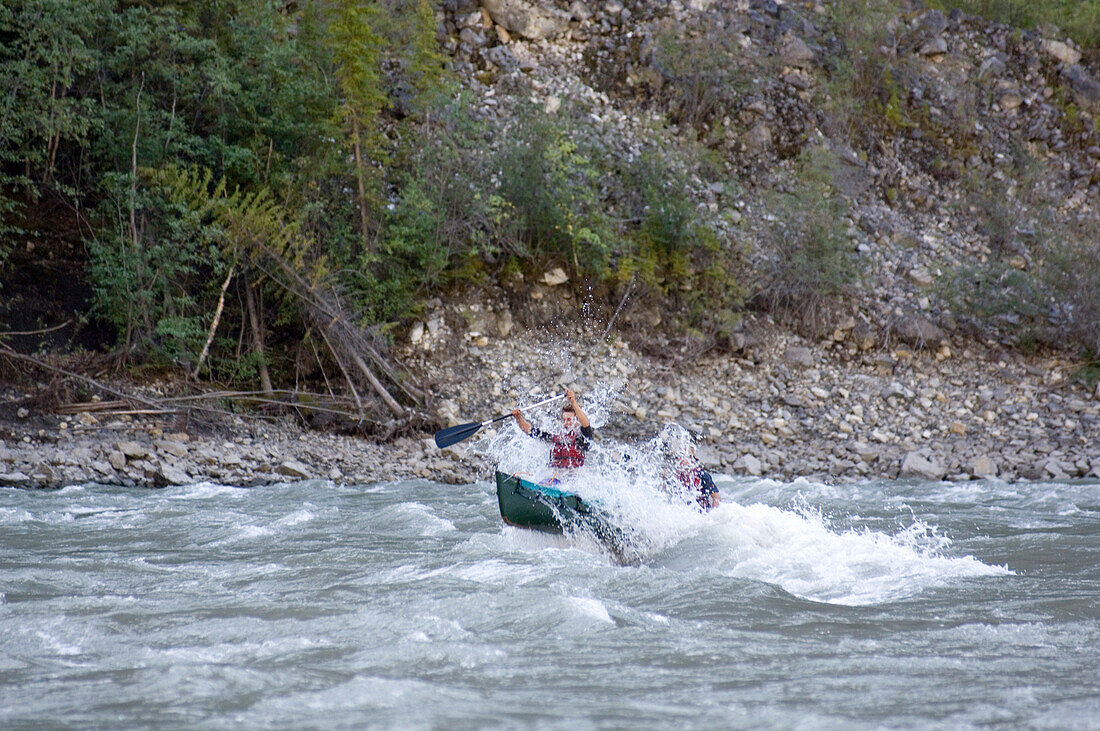 Two People in canoo on South Nahanni River, Canada