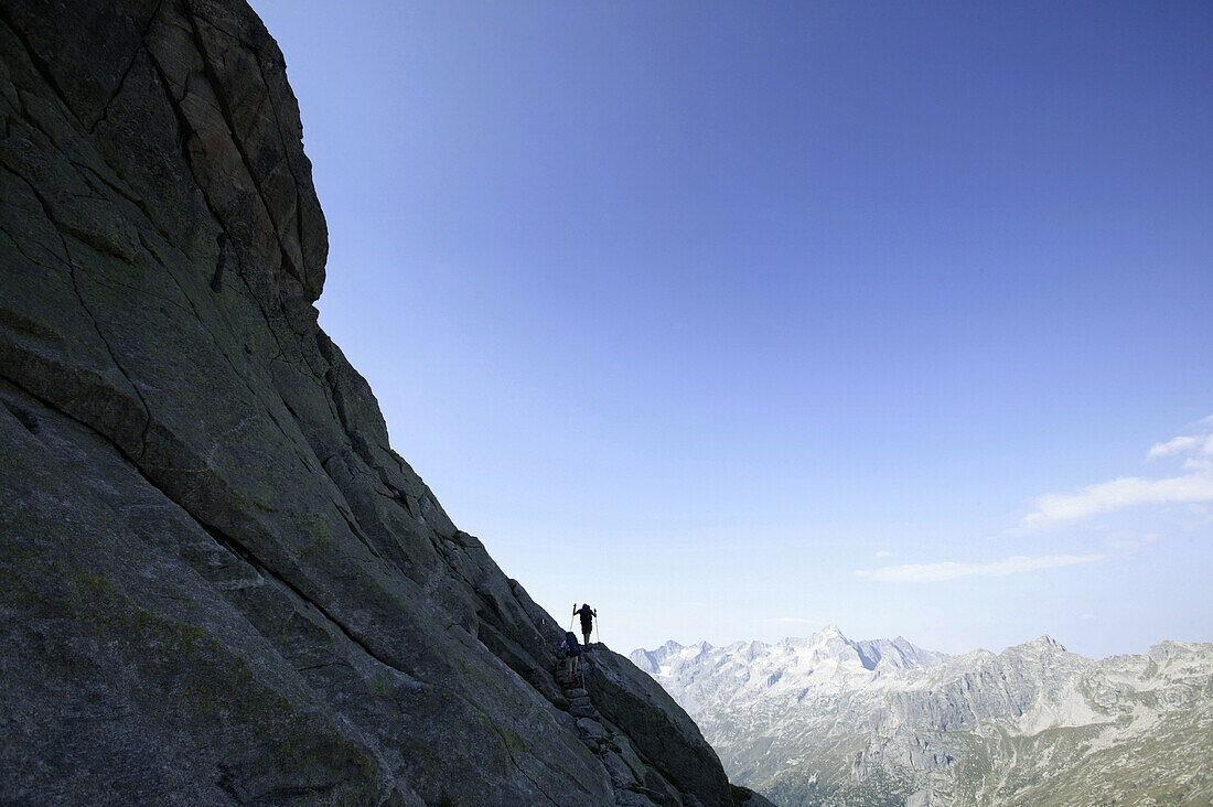 Hiker on passo del Camerozzo, Sentiero Roma, Bregaglia, Lombardy, Italy