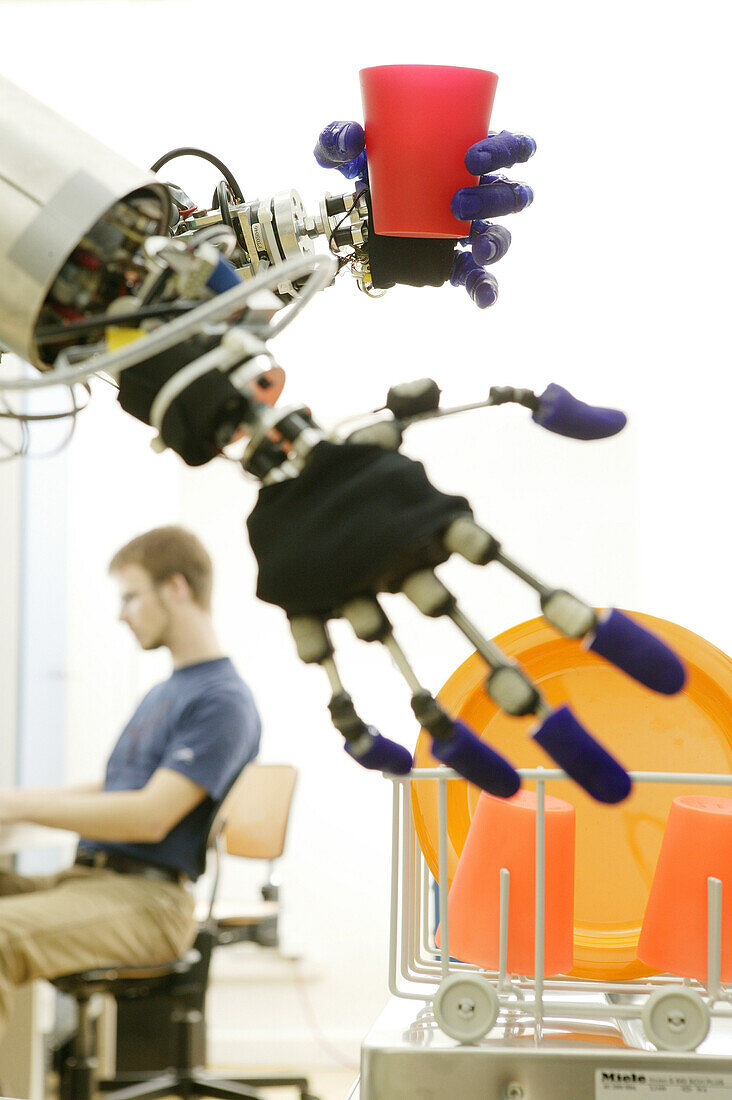 Humanoid robot, ARMAR, Fluid Hand, Test run for robot control, Loading the dishwasher, Robot Kitchen, Dipl Phys Kristian Regenstein, Institute für Rechnerentwurf und Fehlertoleranz at Karlsruhe University, 2004