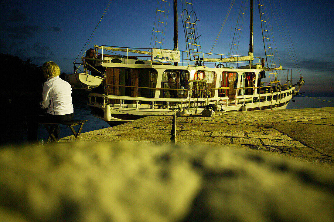 Fishing boat at Osor Harbour at dusk, Cres Island, Croatia