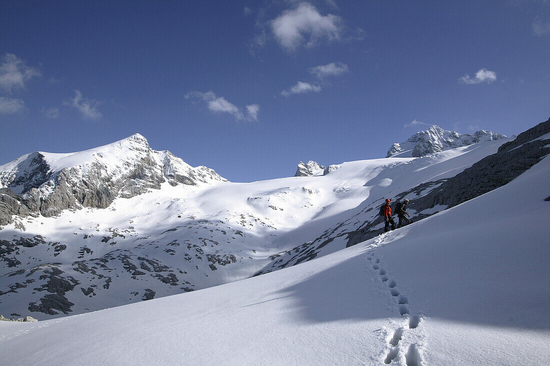 Two mountaineers walking to Schöberl, Hallstätter Glacier, Dachstein, Austria