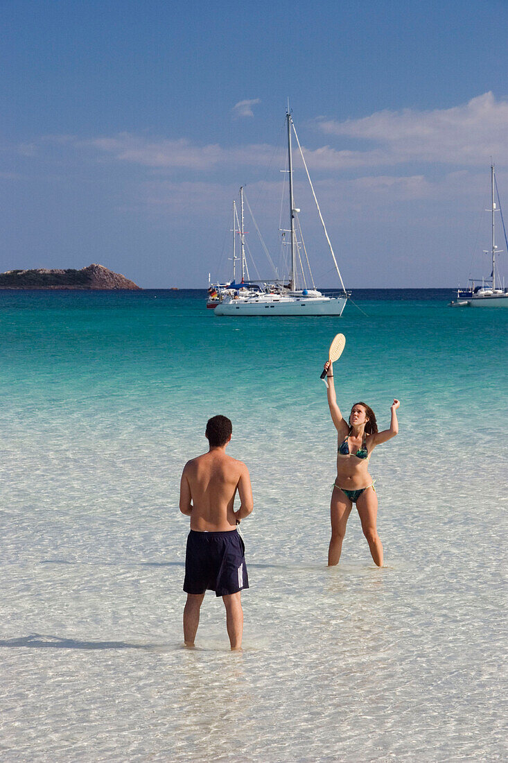 Couple playing at Cala Brandinchi Beach, eastcoast, Sardinia, Italy