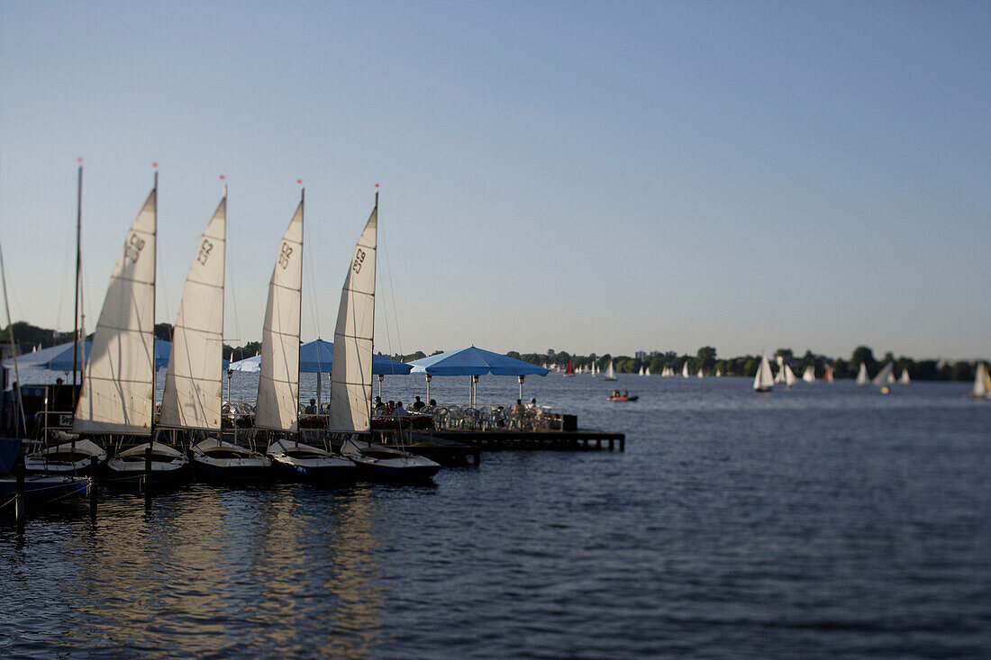Sailing boats on a sunny day on the river Aussenalster, Hamburg, Germany