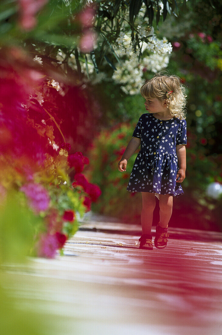 Little girl walking on trail