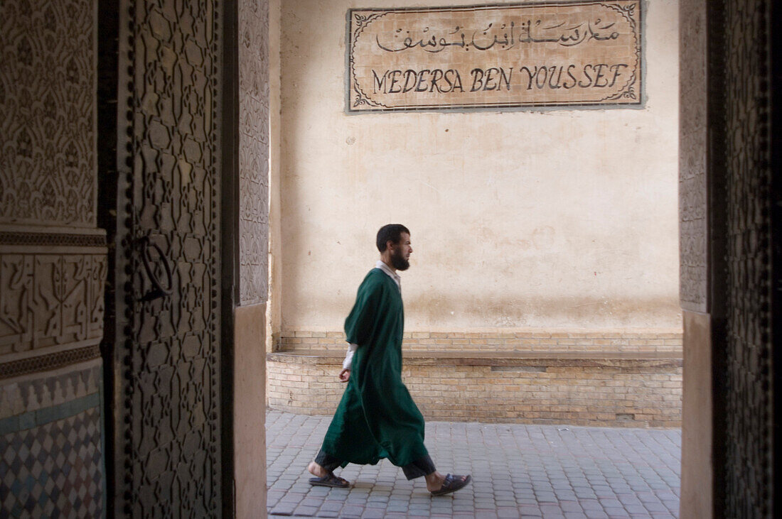 Moslem passing, Medersa Ben Youssef, Marrakech