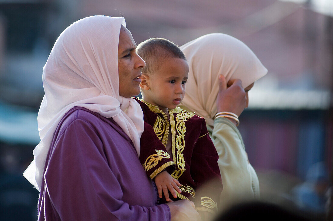 Women with little boy, Place Jemaa el Fna, Marrakech, Morocco