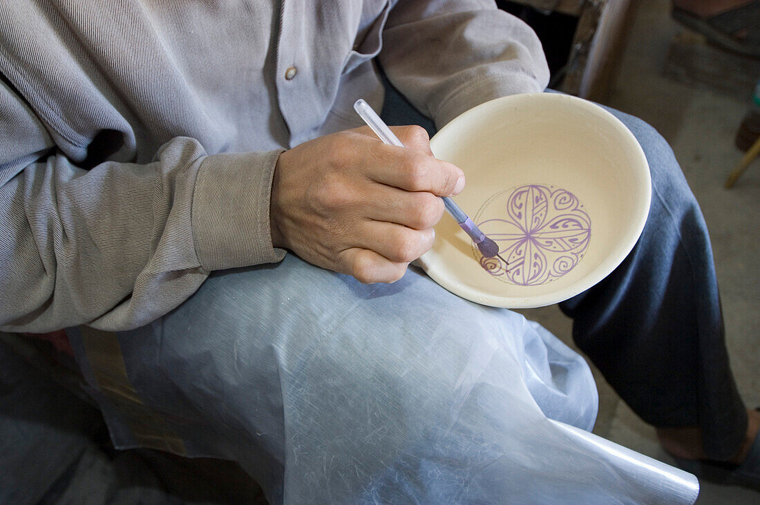 Potter painting bowl, Fes, Morocco