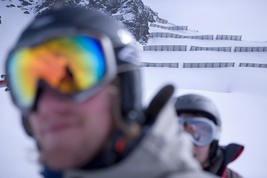 Two young people wearing ski googles, Kuehtai, Tyrol, Austria