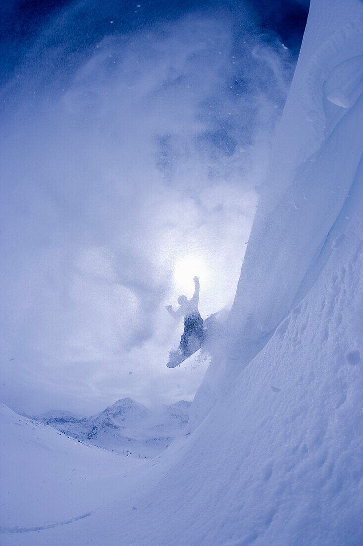 Snowboarder in a cloud of snow, Kuehtai, Tyrol, Austria