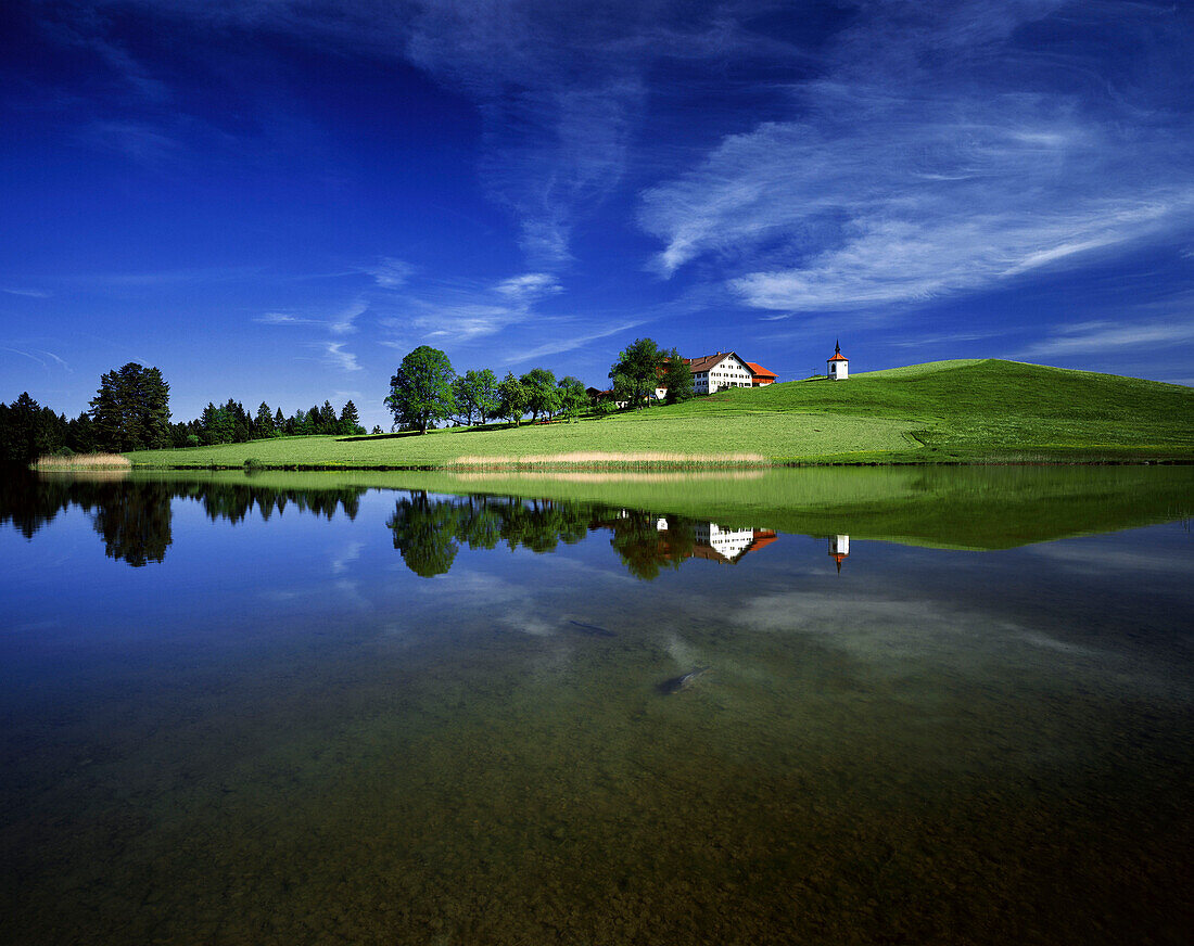 Farm House with chapel Hergatsried, lake Hergatsried, nerar Fuessen, Allgaeu, Germany