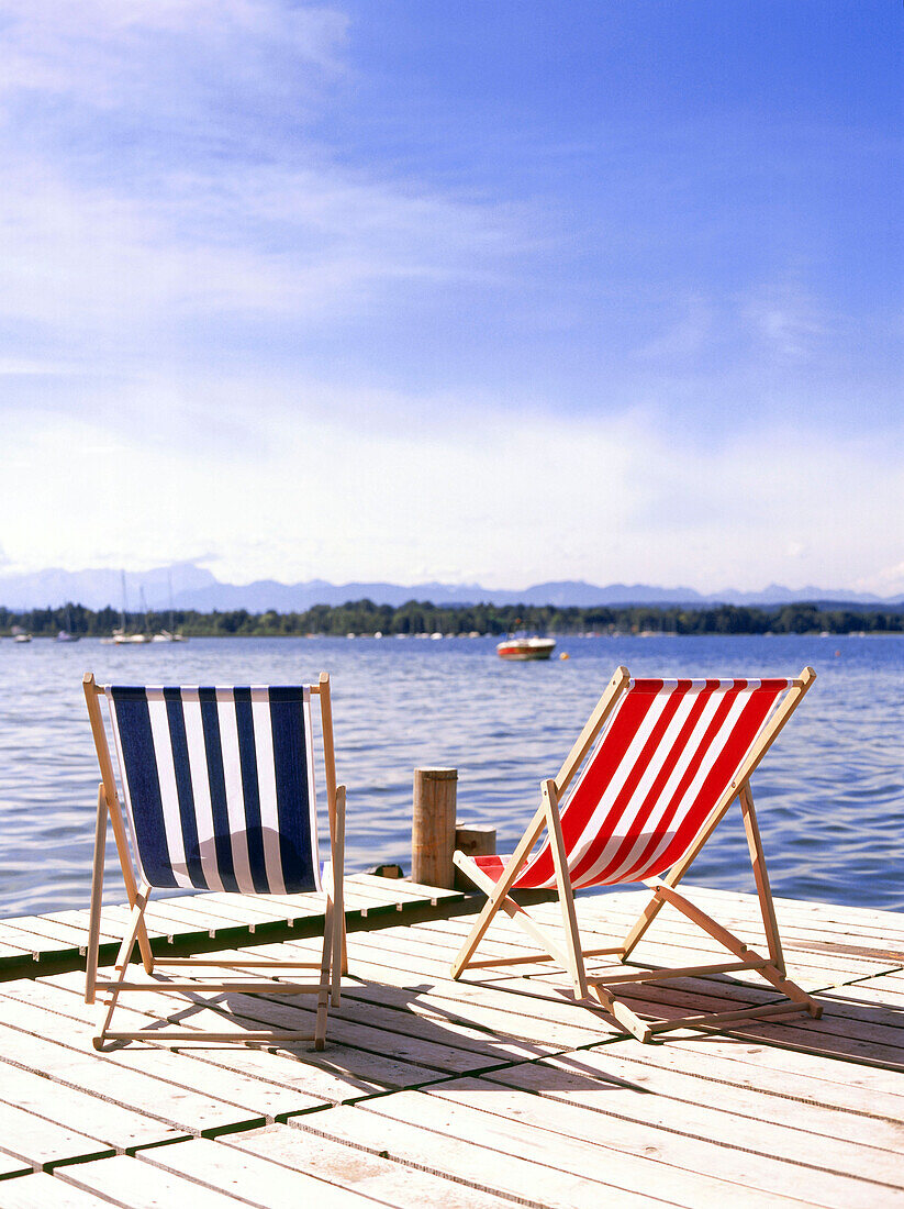 Stripy deckchairs on jetty, Starnberger See, Upper Bavaria, Deutschland