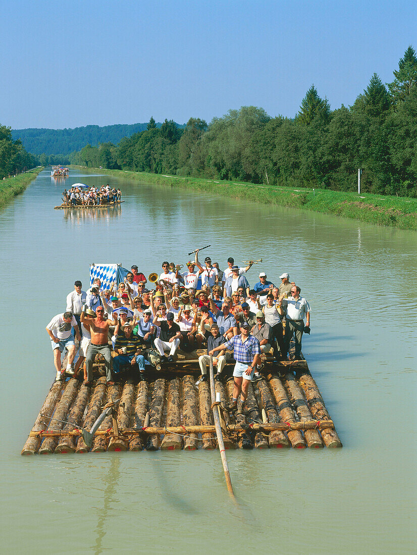 Group of people on wooden raft, River Isar, Pupplinger Au, Upper Bavaria, Germany