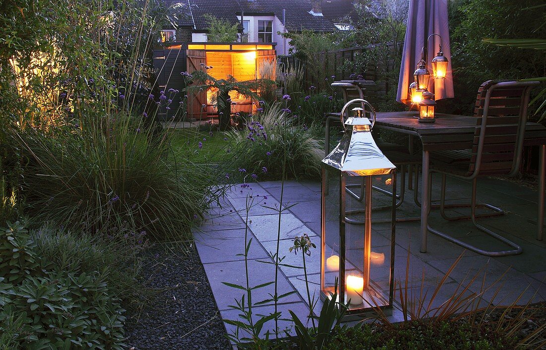 A garden lit by lanterns